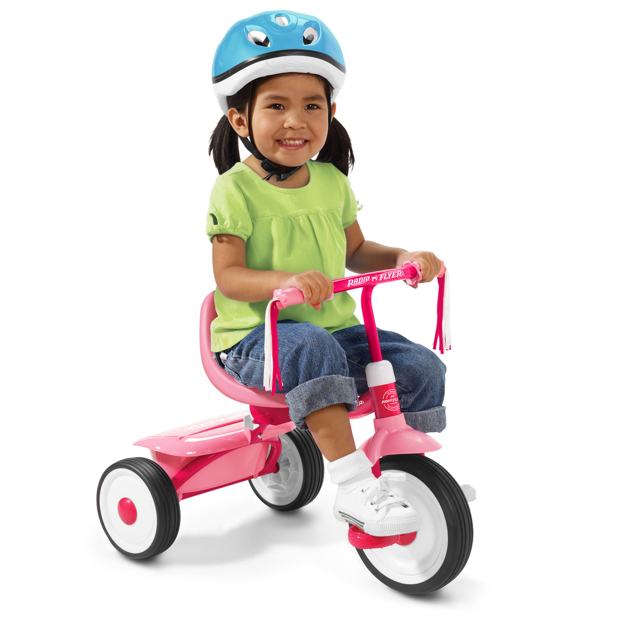 Child riding a pink tricycle with a blue helmet on a white background