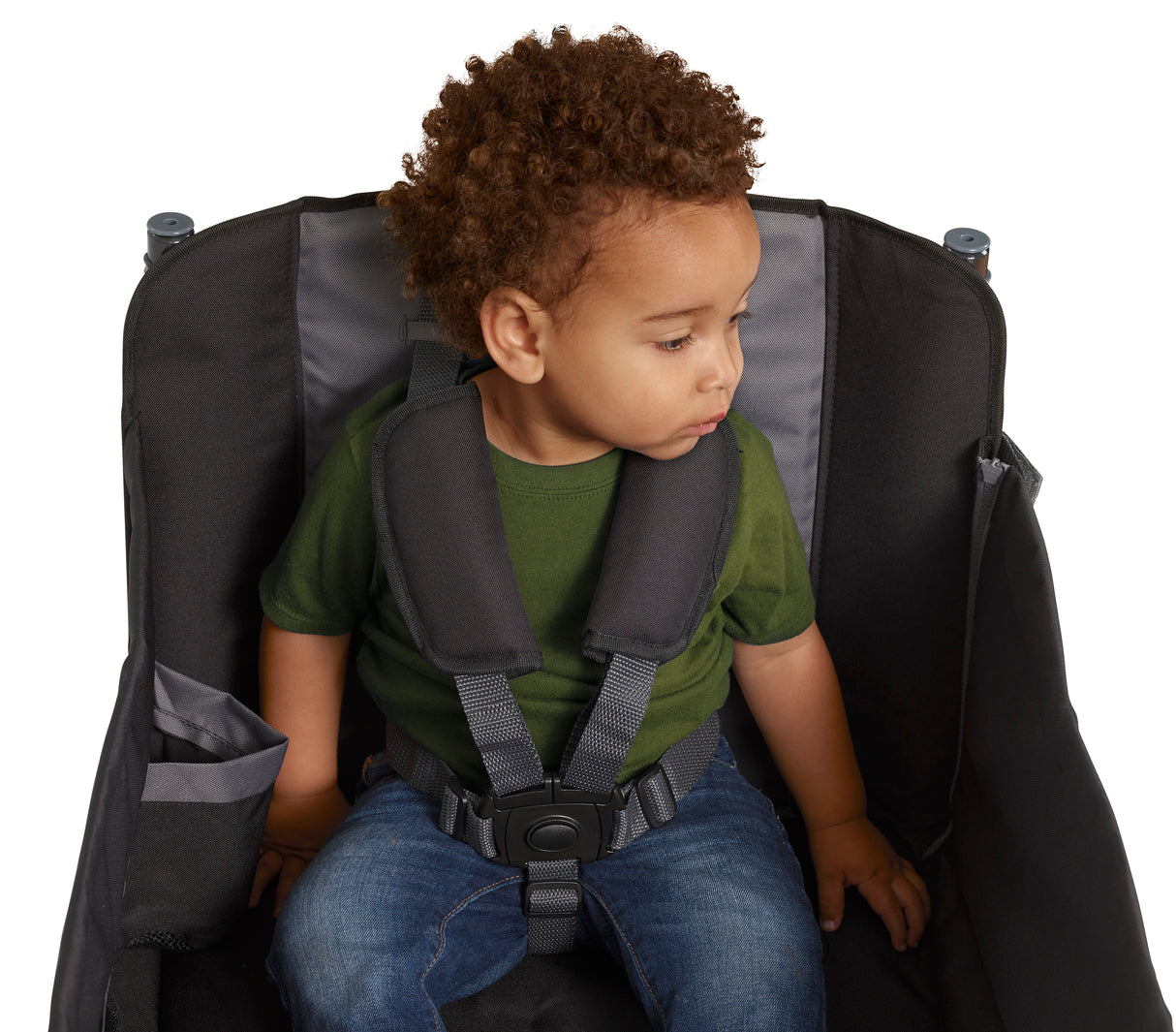 Child sitting in the wagon wearing the 5-point harness with shoulder pads