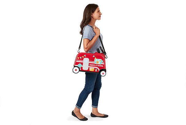 Boy riding the 3-in-1 Happy Trav’ler: Camper