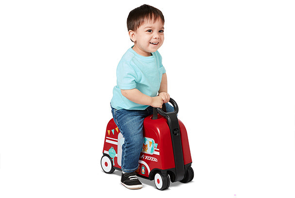 Woman carrying 3-in-1 Happy Trav’ler: Camper with included nylon strap