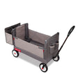Gray folding wagon with a rear storage bag and pull handle on a white background