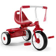 Red tricycle with streamers on a white background