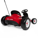 Zoomed in view of the rear slick drifting wheels of a red and black go kart