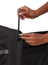 Person adjusting the canopy pole on the wagon frame