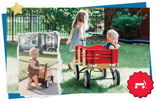 Two children playing with red wagons in a backyard.