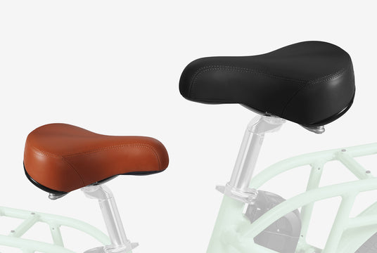 Two bicycle seats: one in a tan color and one in a black color.