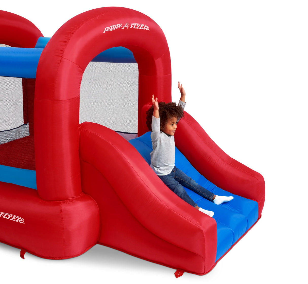 Child Sliding Down the Backyard Bouncer Jr's Built-in Slide